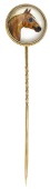 An early 20th century reverse painted crystal intaglio stickpin, depicting the head of the chestnut stallion,...