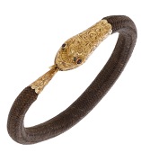 A mid 19th century hairwork memorial bracelet, the braided hair to a gold serpent head clasp with engraved foliate...