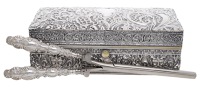 A Victorian silver travelling hair styling case, of rectangular form, the exterior relief decorated with scrolling...