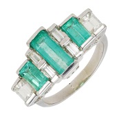 An emerald and diamond dress ring, set with alternating step-cut emeralds and step-cut diamonds, total diamond...