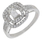 A diamond dress ring, the cut-cornered step-cut diamond within a tiered surround set with brilliant-cut diamonds,...