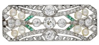 An Art Deco emerald, diamond and pearl brooch, of rectangular form with canted corners, pierced throughout and set...