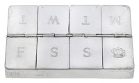 A silver ‘Pill’ box, divided into compartments for the days of the week, by Garrard & Co., London 2004,...