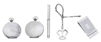 A silver engine-turned money clip by Dunhill, a Tiffany & Co. ballpoint pen stamped ‘925’, Germany, a key ring...