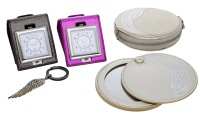 Wings Collection by Jade Jagger for Garrard & Co., comprising two travelling pocket alarm clocks in folding soft...