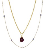 Two gem-set necklaces, comprising a belcher-link chain suspending a garnet bead and rose-cut diamond drop, stamped...