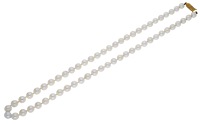 A cultured pearl necklace by Mikimoto, 1980, the uniform row of cultured pearls to a 9ct gold clasp with starburst...