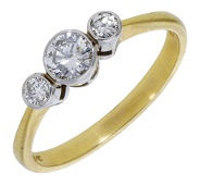A diamond three stone ring, set with a graduated row of brilliant-cut diamonds in 18ct gold, UK hallmark, total...