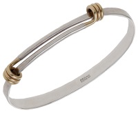 A ‘Grand Signature Bracelet’ bangle by Ed Levin, of bicolour design, with coiled sprung fastener, signed,...