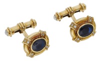 A pair of 18ct gold, sapphire and diamond cufflinks by Deakin & Francis, 2002, the oval panels with oval-mixed cut...