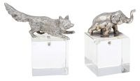 A silver model of a running fox, and a silver small elephant finial,  the fox unmarked, the elephant with import...