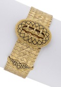 A late 19th century gold buckle bracelet, the fancy-link strap with lozenge-shaped decoration, the buckle and...