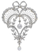 An early 20th century diamond brooch / pendant, of pierced garland design with lattice and foliate detailing and a...