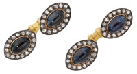 A pair of sapphire and diamond cufflinks, the sapphire cabochons within marquise-shaped surrounds of rose-cut...