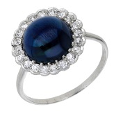 A sapphire and diamond cluster ring, the circular sapphire cabochon within a surround of single-cut diamonds, total...