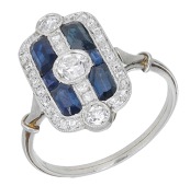 An Art Deco sapphire and diamond ring, French, the cushion-shaped panel set with calibré-cut sapphires, old...