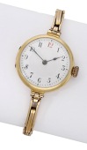 Swiss. A gold wristwatch, circa 1920.
Movement: manual winding.
Dial: white enamel, Arabic numerals.
Case: 18ct...