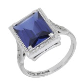 A synthetic sapphire ring, the step-cut synthetic sapphire between shoulders set with rose-cut diamonds, maker’s...