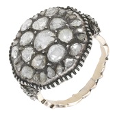An antique diamond cluster ring, the central plaque set throughout with rose-cut diamonds, between similarly-set...