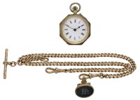 Swiss. A gold open-faced keyless watch together with a gold Albert chain and fob seal, circa 1900.
Movement:...