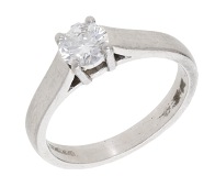 A diamond single stone ring, set with a brilliant-cut diamond, mounted in platinum, UK hallmark, diamond weight...