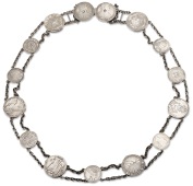 A silver coin belt, the chain links uniting fifteen mainly 18th and 19th century coins, to include a Spanish dollar...