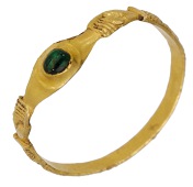 A Medieval emerald stirrup ring, circa 13th - 14th century, the raised bezel supporting a cabochon emerald, between...