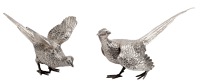 A pair of silver cock and hen pheasant table ornaments, realistically modelled, by Asprey & Garrard, London 1999,...