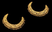 A pair of rare Malay gold filigree crescent-shaped panels, Sumatra, 18th century / early 19th century, possibly...