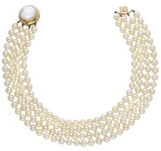 A cultured pearl necklace, the four rows of cultured pearls, measuring approximately 8.4mm, to a circular clasp with...