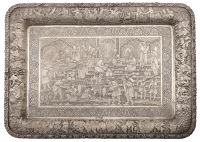 A Persian (Iranian) tray, late 20th century, rectangular and with curved angles, centred with an engraved scene...