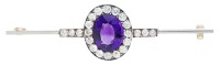 An amethyst and diamond cluster bar brooch, circa 1900, the oval-cut amethyst within a surround of old brilliant-cut...