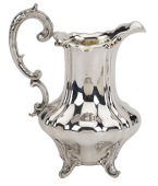 A Victorian silver cream jug, with lobed baluster body and double ‘C’ scroll handle, by Messrs Barnard, London...