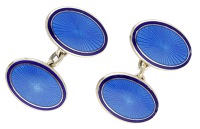 A pair of silver gilt and enamel cufflinks by KJD Jewellers, the oval panels with two-toned blue guilloché enamel,...