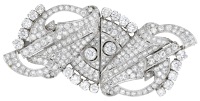 A mid 20th century diamond double-clip brooch, of openwork scroll design, set throughout with brilliant and...