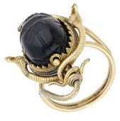 A 19th century scarab ring, the black hardstone scarab bead with figural intaglio to the reverse, within a beaded...