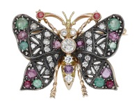 A gem-set butterfly brooch, of pierced design, set with circular-cut rubies, emeralds, brilliant, single and...