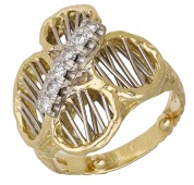 A diamond ring by David Morris, 1971, of abstract quatrefoil design, bicolour and with openwork spoke detailing and...