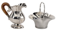 A Continental silver small cream jug, of lobed baluster from, with scroll engraved panels, wood handle, Swedish...