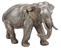 A silver model of an elephant by Camelot Silverware Ltd, realistically modelled, standing with trunk curled, with...