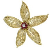 A gem-set flower brooch, circa 1960, the ropetwist flowerhead with a cluster of circular-cut rubies and...