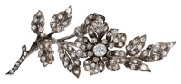 A diamond spray brooch, circa 1890, set throughout with rose-cut diamonds with a central cushion-shaped diamond to...