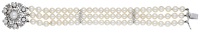 A cultured pearl and diamond bracelet, the three rows of cultured pearls, measuring approximately 6.3mm, with...