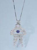 A mid 20th century Burmese sapphire and diamond brooch / pendant, set with a cut-cornered sapphire within an...