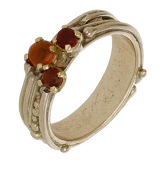 A 9ct gold fire opal ring by Ingeborg Bratman, 1989, of continuous wire and bead design, with three fire opal...