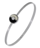 A diamond bangle, the plain polished torque with black and white demi-lune plaques and a brilliant-cut diamond...