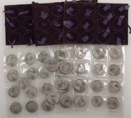 The Kings and Queens of England, 1830, a set of 35 white metal medals by E. Thomason after J. Dassier, and by J....