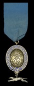 King’s Messenger Badge, G.VI.R., silver-gilt and enamel with pendant silver greyhound, the reverse officially...